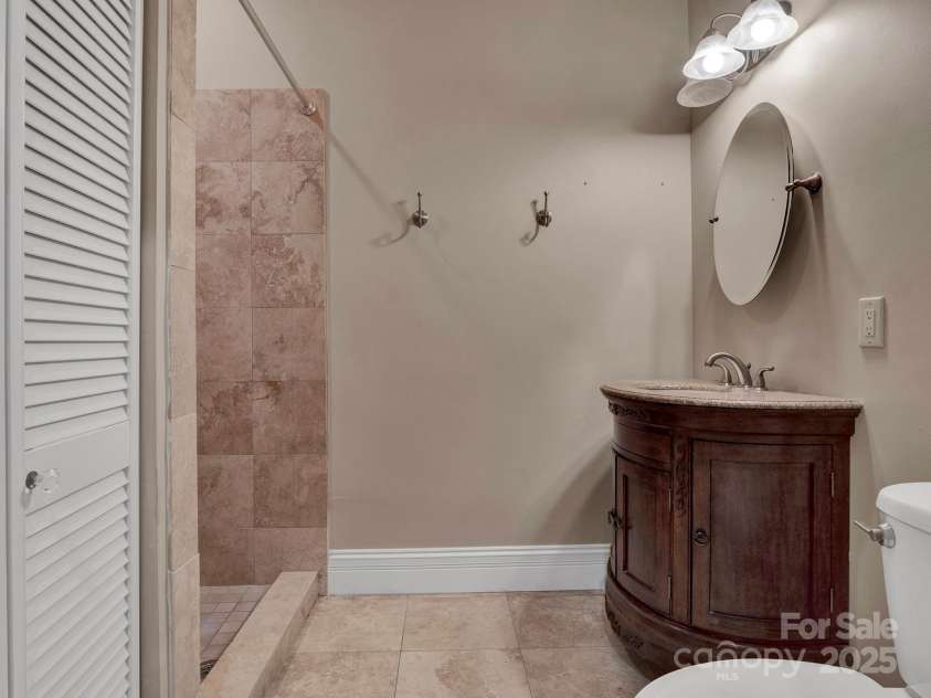 225 Riverton Road, Weddington, NC 28104.  MLS# CAR4306404, YatesRealty ID 13305. Lower Level Bathroom with walk in shower