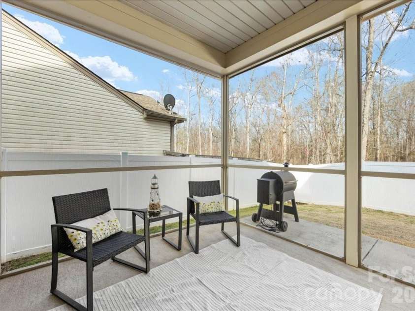 154 Sutters Mill Drive, Troutman, NC 28166.  MLS# CAR4356786, YatesRealty ID 13314. Covered screened patio.