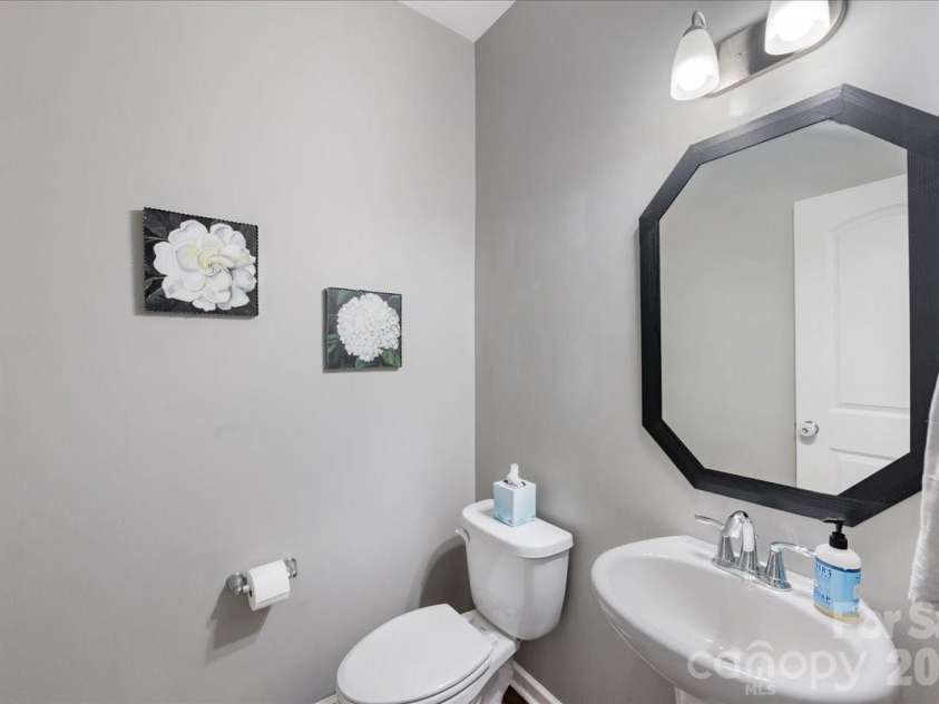 154 Sutters Mill Drive, Troutman, NC 28166.  MLS# CAR4356786, YatesRealty ID 13314. Half bathroom on the main floor.