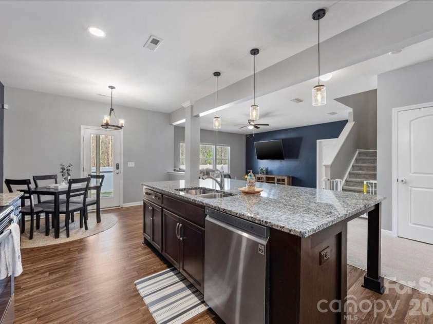 154 Sutters Mill Drive, Troutman, NC 28166.  MLS# CAR4356786, YatesRealty ID 13314. Kitchen has open concept floor plan with direct access to great room and breakfast area.
