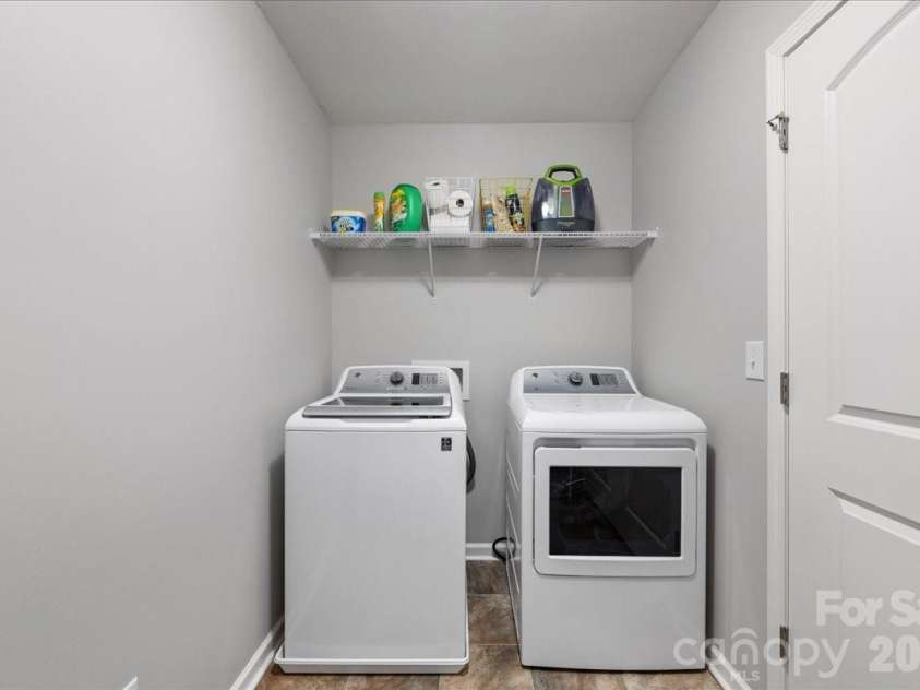 154 Sutters Mill Drive, Troutman, NC 28166.  MLS# CAR4356786, YatesRealty ID 13314. Large laundry room.