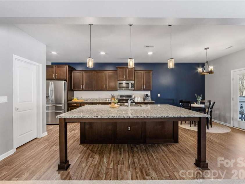 154 Sutters Mill Drive, Troutman, NC 28166.  MLS# CAR4356786, YatesRealty ID 13314. Spacious chef's kitchen with huge island!