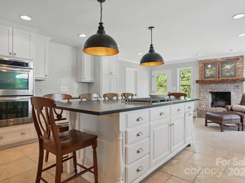 411 Baucom Deese Road, Monroe, NC 28110.  MLS# CAR4251060, YatesRealty ID 13320. Huge island and double oven in this beautiful kitchen.