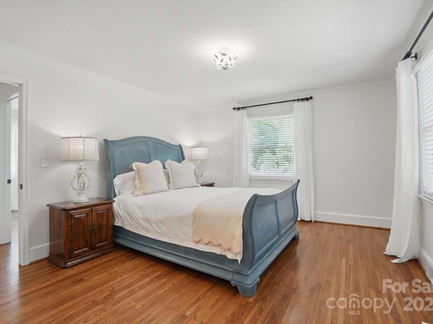 411 Baucom Deese Road, Monroe, NC 28110.  MLS# CAR4251060, YatesRealty ID 13320. Light filled primary bedroom with en suite bath and walk in closet.