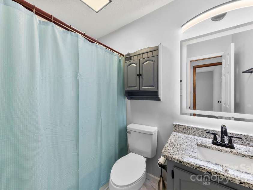 5034 Clearwater Lake Road, Mount Holly, NC 28120.  MLS# CAR4203029, YatesRealty ID 13328. Hall Bathroom