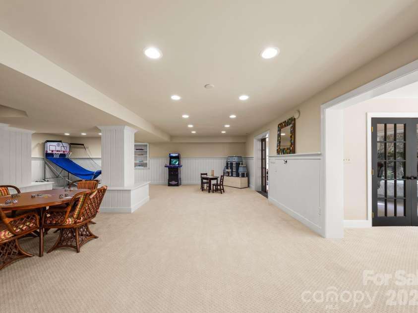 7024 Riesman Lane, Charlotte, NC 28210.  MLS# CAR4355789, YatesRealty ID 13329. Lower-level entertainment area. 