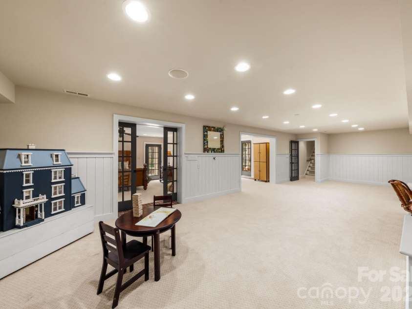 7024 Riesman Lane, Charlotte, NC 28210.  MLS# CAR4355789, YatesRealty ID 13329. Lower-level entertainment area.
