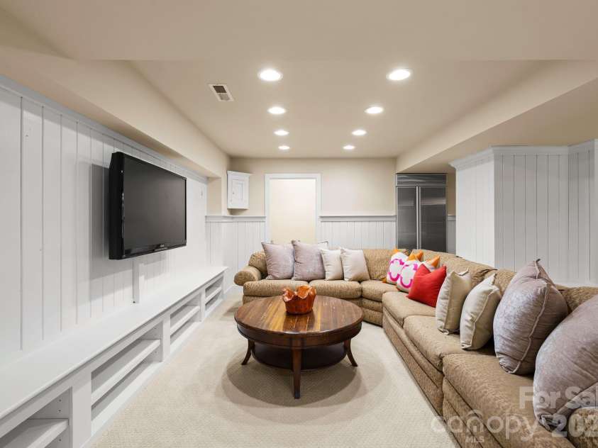 7024 Riesman Lane, Charlotte, NC 28210.  MLS# CAR4355789, YatesRealty ID 13329. Lower-level entertainment area. 