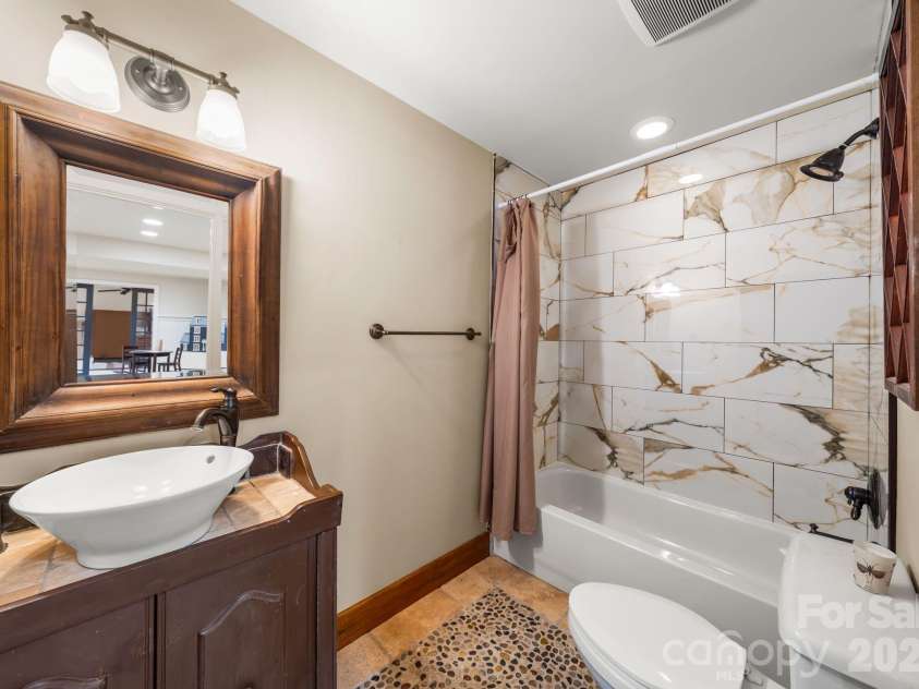 7024 Riesman Lane, Charlotte, NC 28210.  MLS# CAR4355789, YatesRealty ID 13329. Lower-level full bathroom.