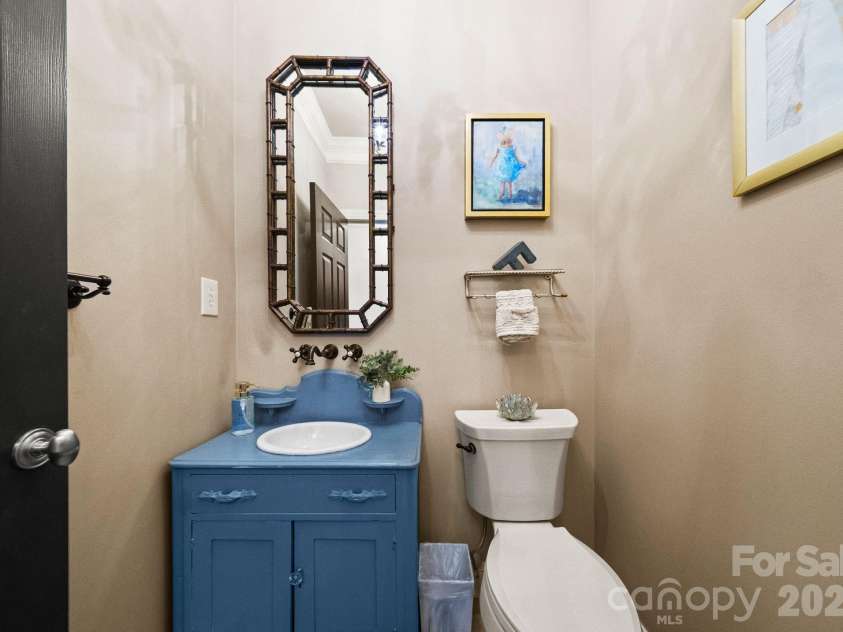 7024 Riesman Lane, Charlotte, NC 28210.  MLS# CAR4355789, YatesRealty ID 13329. Main-level half bathroom.