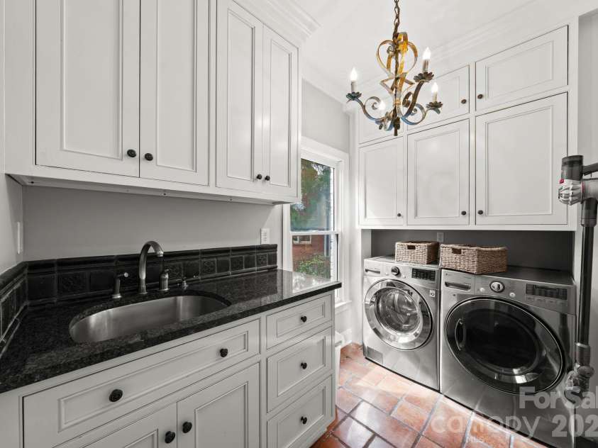 7024 Riesman Lane, Charlotte, NC 28210.  MLS# CAR4355789, YatesRealty ID 13329. Main-level laundry room.
