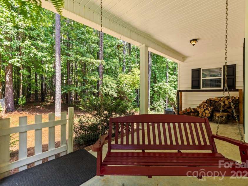 1956 Forest Ridge Drive, Stanley, NC 28164.  MLS# CAR4253801, YatesRealty ID 13330. Fenced area just off front/side porch for dogs to roam safely