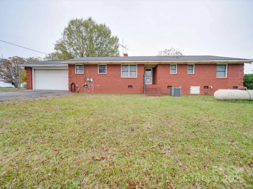 3113 Old Pageland Marshville Road, Wingate, NC 28174.  MLS# CAR4274721, YatesRealty ID 13332. Back of home. 3