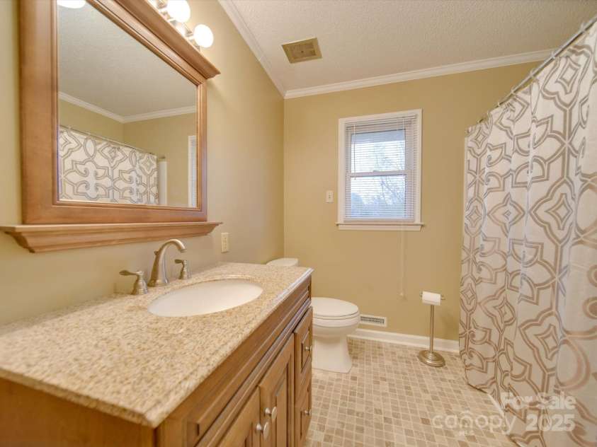 3113 Old Pageland Marshville Road, Wingate, NC 28174.  MLS# CAR4274721, YatesRealty ID 13332. Updated bathroom
