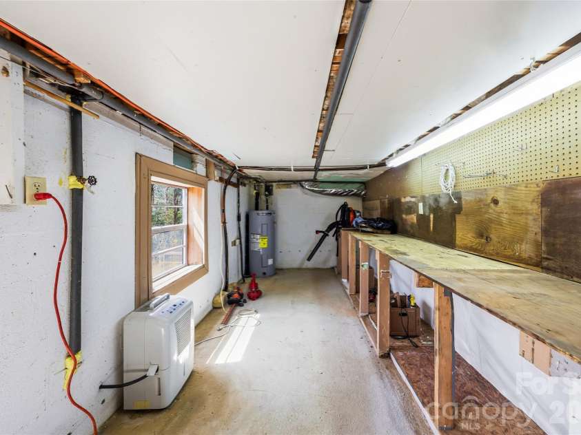 143 Rocky Ridge Road, Pisgah Forest, NC 28768.  MLS# CAR4364928, YatesRealty ID 13336. Basement storage