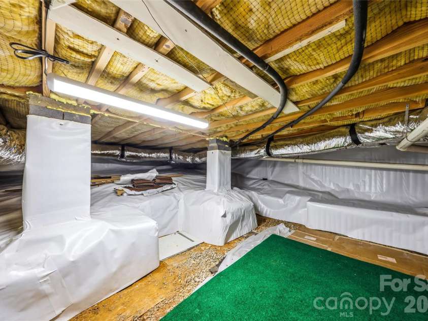 143 Rocky Ridge Road, Pisgah Forest, NC 28768.  MLS# CAR4364928, YatesRealty ID 13336. Basement storage