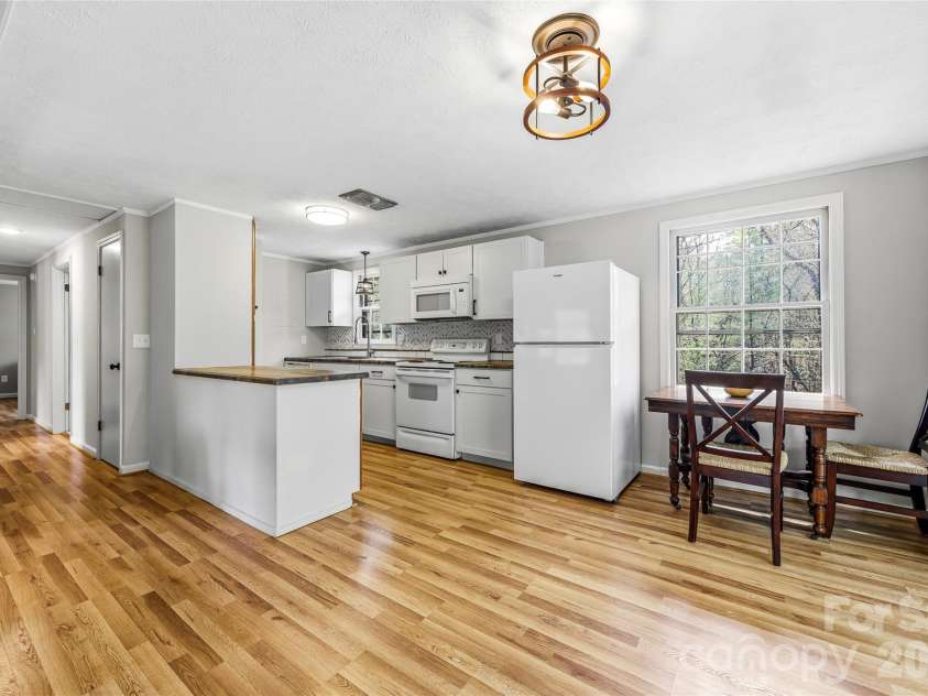143 Rocky Ridge Road, Pisgah Forest, NC 28768.  MLS# CAR4364928, YatesRealty ID 13336. Dining/Kitchen