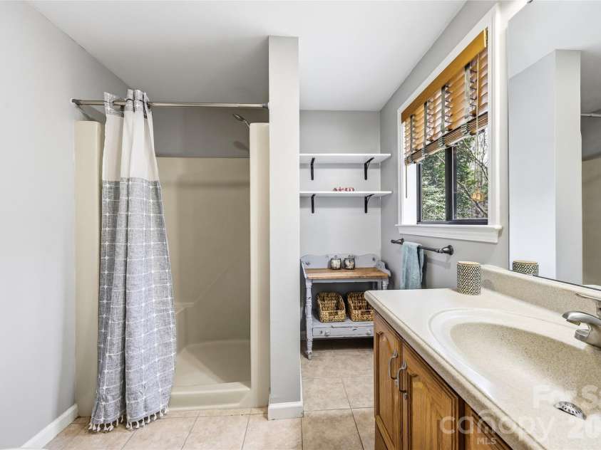 143 Rocky Ridge Road, Pisgah Forest, NC 28768.  MLS# CAR4364928, YatesRealty ID 13336. Primary ensuite