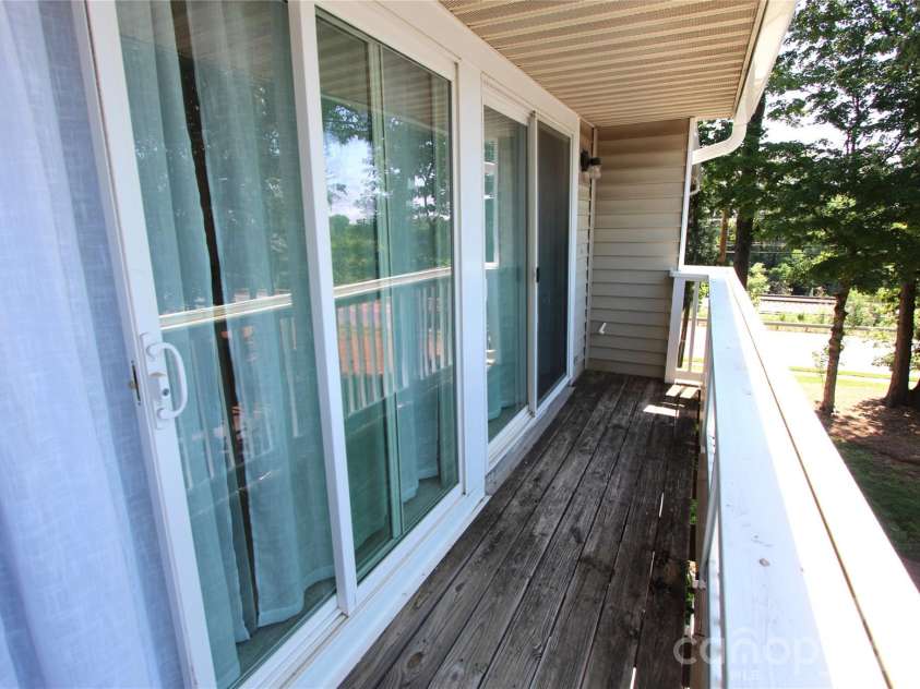 1645 Arlyn Circle, Charlotte, NC 28213.  MLS# CAR4354534, YatesRealty ID 13338. Sliding glass doors with a covered decking to enjoy.
