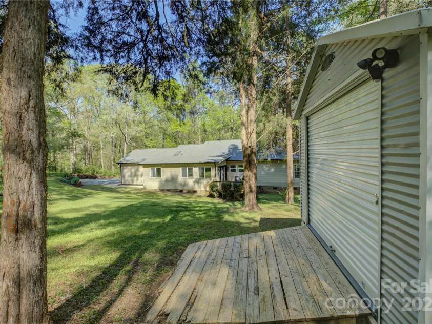 8322 Loma Linda Lane, Waxhaw, NC 28173.  MLS# CAR4238719, YatesRealty ID 13341. Back yard Area and Work shop/shed.