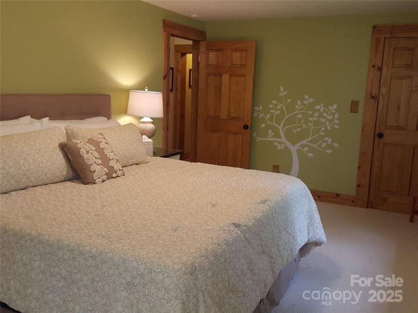 142 Cherrywood Lane, Pisgah Forest, NC 28768.  MLS# CAR4312423, YatesRealty ID 13342. Main floor bedroom 2
