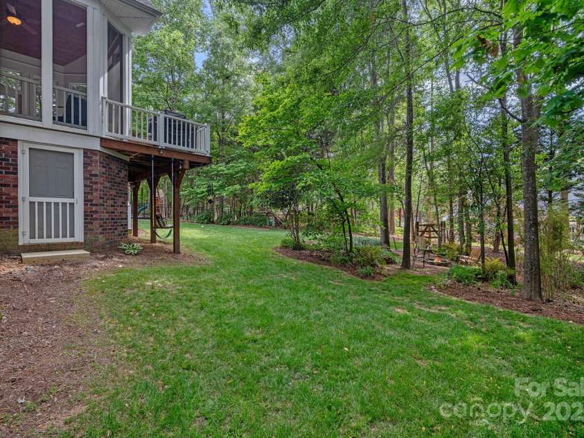 202 Whitmyre Court, Fort Mill, SC 29715.  MLS# CAR4251469, YatesRealty ID 13342. The Screen door leads to a nice sized workshop