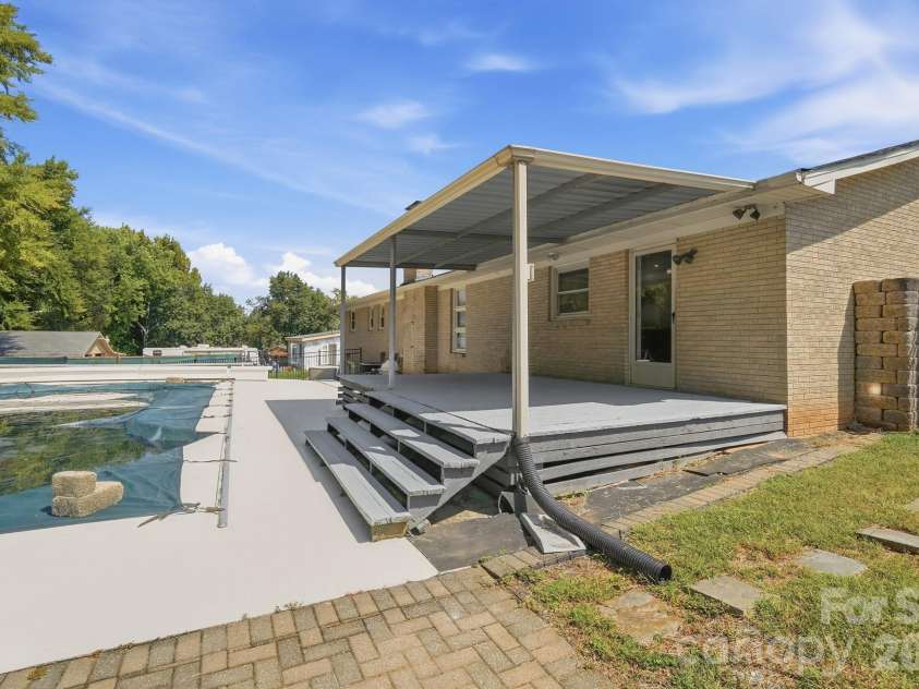 213 Lakeview Drive, Harrisburg, NC 28075.  MLS# CAR4426223, YatesRealty ID 13351. Backyard patio & Pool