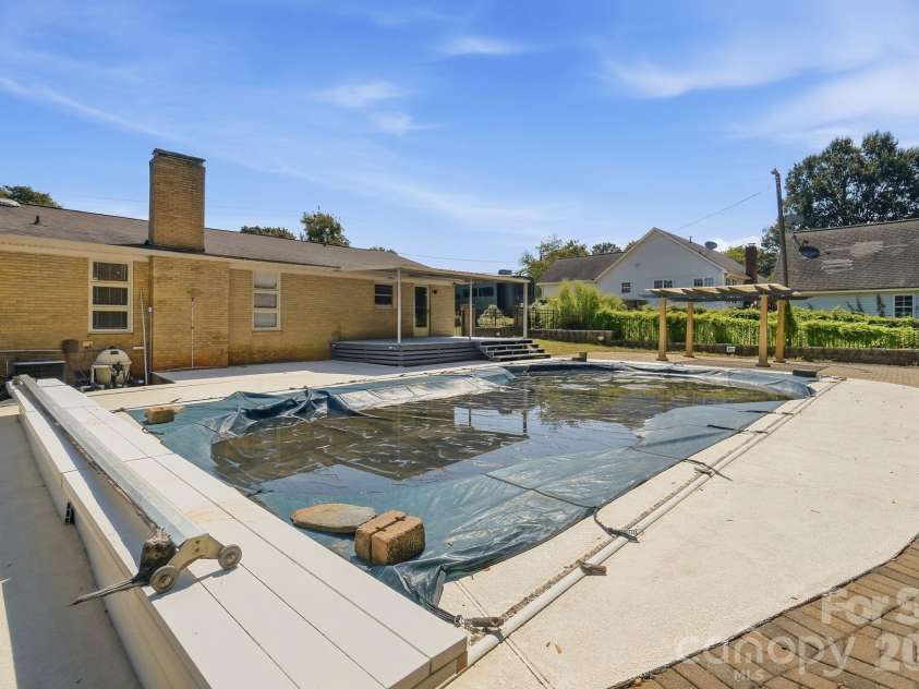 213 Lakeview Drive, Harrisburg, NC 28075.  MLS# CAR4426223, YatesRealty ID 13351. Backyard patio & Pool