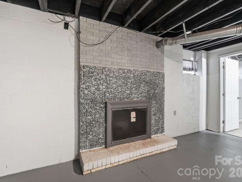 213 Lakeview Drive, Harrisburg, NC 28075.  MLS# CAR4426223, YatesRealty ID 13351. Basement Fireplace