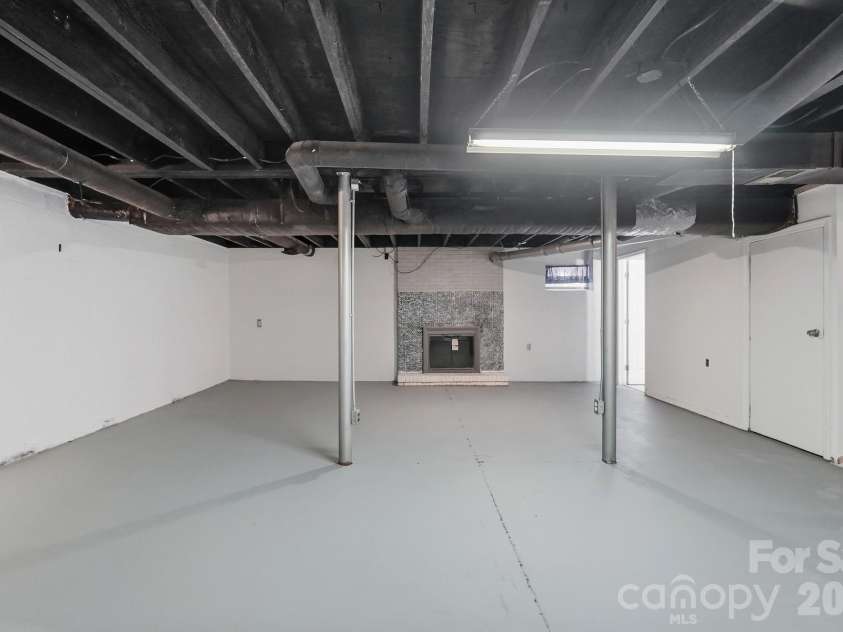 213 Lakeview Drive, Harrisburg, NC 28075.  MLS# CAR4426223, YatesRealty ID 13351. Basement Fireplace & sitting area