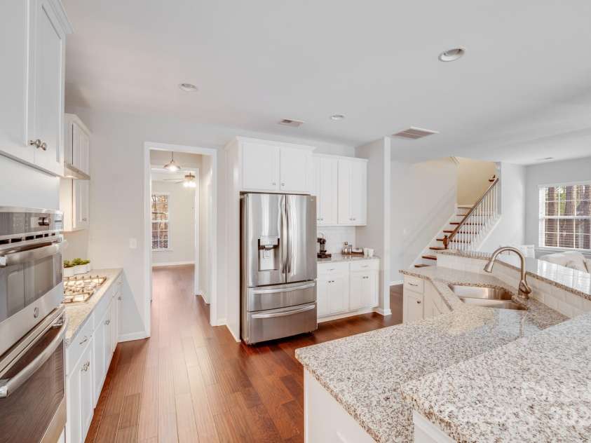 220 Kenway Loop, Mooresville, NC 28117.  MLS# CAR4231089, YatesRealty ID 13351. Kitchen boasts two pantries in space between kitchen and dining room.