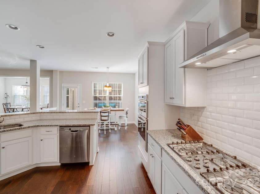 220 Kenway Loop, Mooresville, NC 28117.  MLS# CAR4231089, YatesRealty ID 13351. Love the tile backsplash that adorns this kitchen!