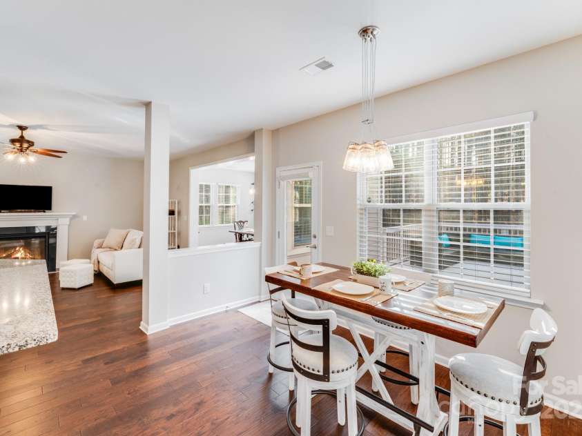 220 Kenway Loop, Mooresville, NC 28117.  MLS# CAR4231089, YatesRealty ID 13351. Open breakfast space overlooking deck iand tree lined back yard!