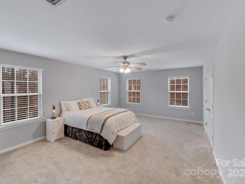220 Kenway Loop, Mooresville, NC 28117.  MLS# CAR4231089, YatesRealty ID 13351. Spacious Owners Suite overlooking tree lined rear yard!