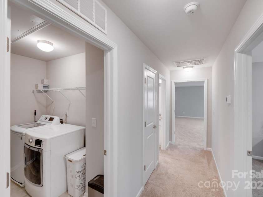 220 Kenway Loop, Mooresville, NC 28117.  MLS# CAR4231089, YatesRealty ID 13351. Upstairs hall and laundry