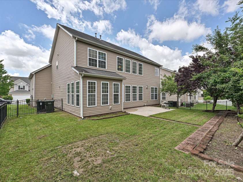 9700 Ravenscroft Lane, Concord, NC 28027.  MLS# CAR4256328, YatesRealty ID 13353. Back of Home
