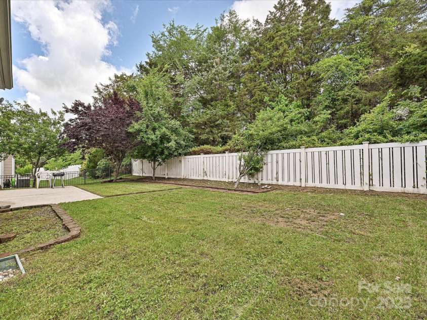 9700 Ravenscroft Lane, Concord, NC 28027.  MLS# CAR4256328, YatesRealty ID 13353. Backyard