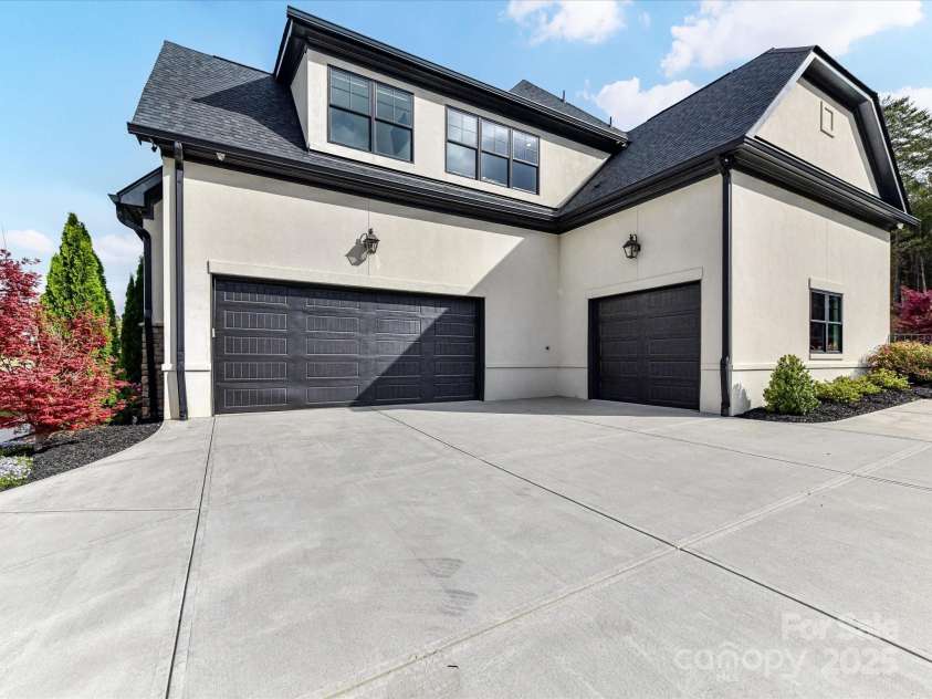 2954 Holbrook Road, Fort Mill, SC 29715.  MLS# CAR4254159, YatesRealty ID 13354. Side Elevation/Garages