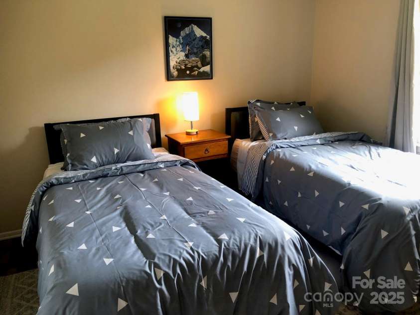 424 Creekside Drive, Asheville, NC 28804.  MLS# CAR4259883, YatesRealty ID 13362. Bedroom with twin beds. Home is now vacant.