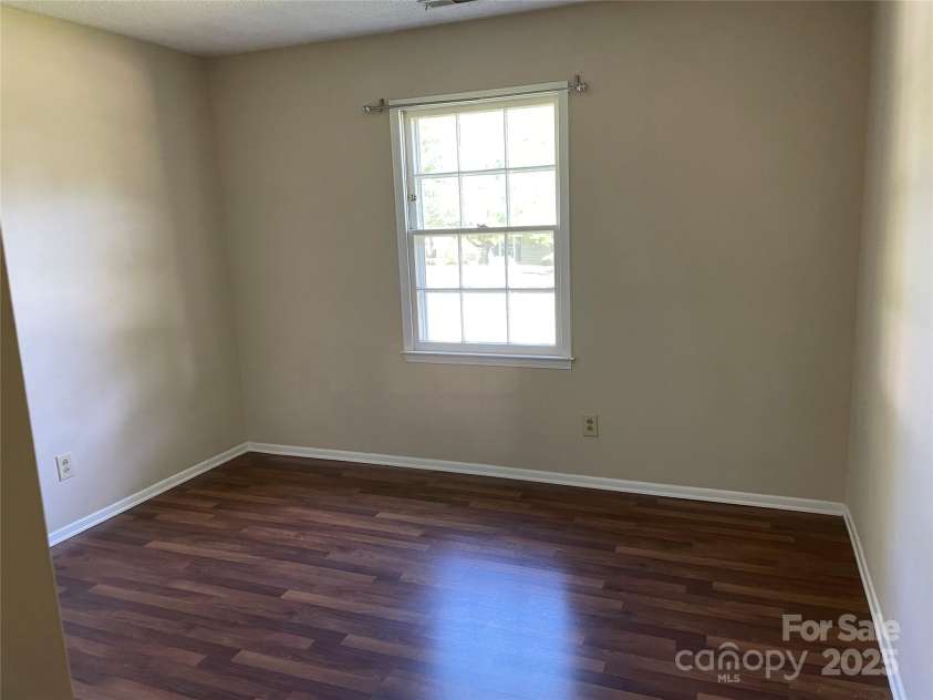 424 Creekside Drive, Asheville, NC 28804.  MLS# CAR4259883, YatesRealty ID 13362. Guest bedroom A looking out onto front yard.