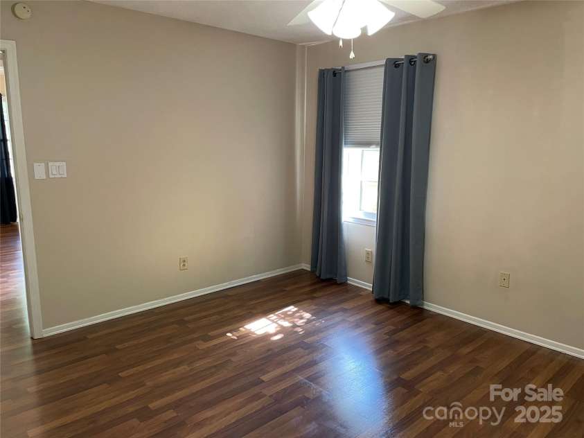 424 Creekside Drive, Asheville, NC 28804.  MLS# CAR4259883, YatesRealty ID 13362. Master bedroom looking toward central hallway.