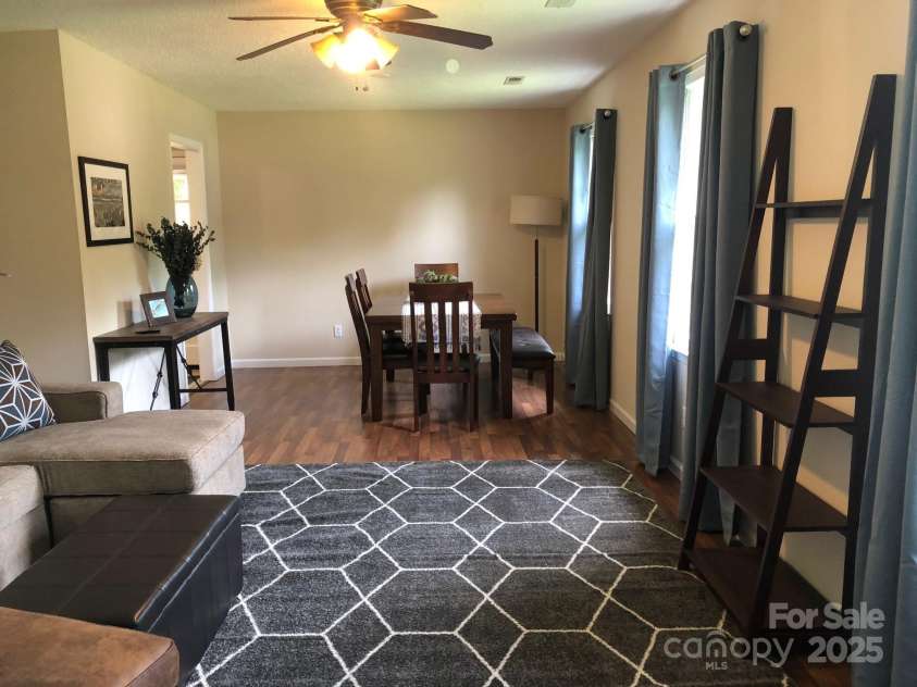 424 Creekside Drive, Asheville, NC 28804.  MLS# CAR4259883, YatesRealty ID 13362. View of dining room from formal living room. Home is now vacant.