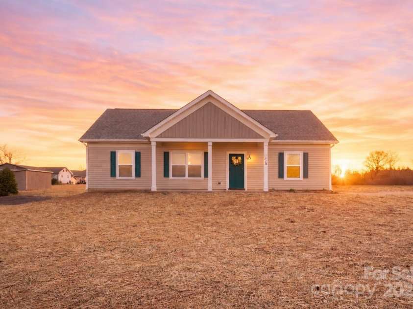 101 Allen Hills Way, Olin, NC 28660.  MLS# CAR4332375, YatesRealty ID 13363. Virtually staged sunset 