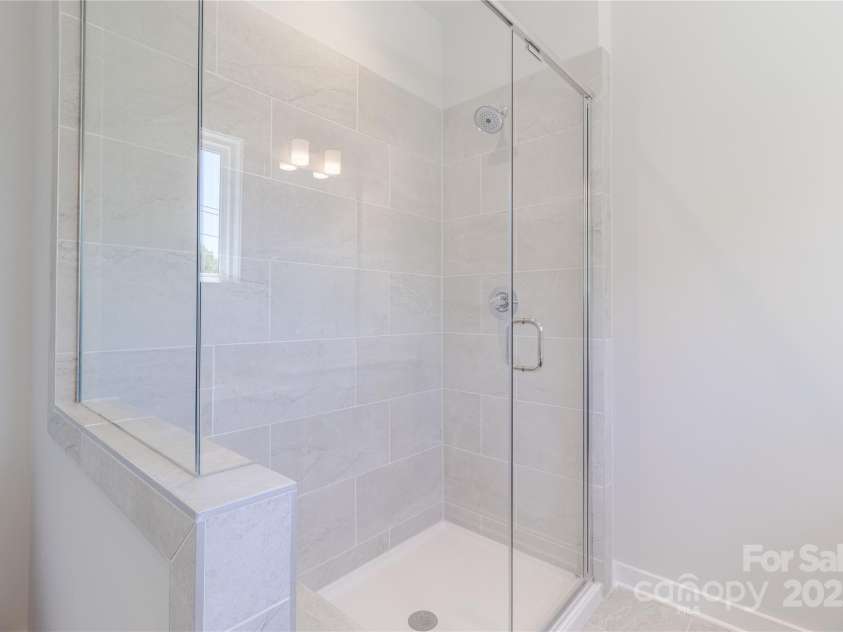 226 Gilead Road, Huntersville, NC 28078.  MLS# CAR4259892, YatesRealty ID 13363. Semi frameless shower