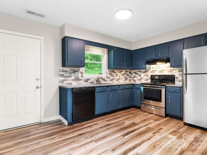 217 Royal Pines Drive, Arden, NC 28704.  MLS# CAR4257398, YatesRealty ID 13374. Another view of the updated kitchen