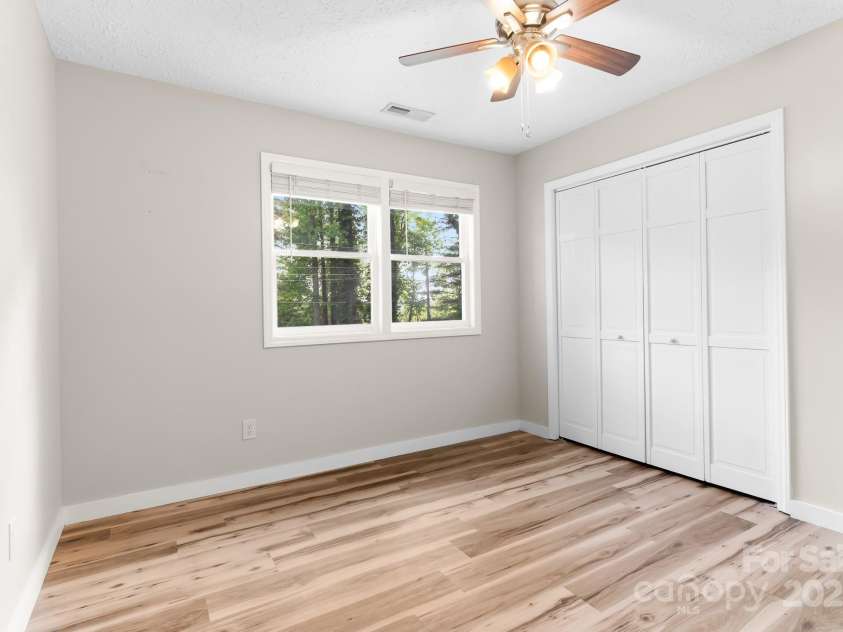 217 Royal Pines Drive, Arden, NC 28704.  MLS# CAR4257398, YatesRealty ID 13374. Front bedroom