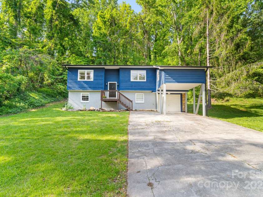 217 Royal Pines Drive, Arden, NC 28704.  MLS# CAR4257398, YatesRealty ID 13374. Plenty of parking, and nice level front yard