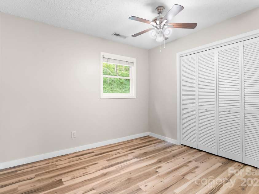 217 Royal Pines Drive, Arden, NC 28704.  MLS# CAR4257398, YatesRealty ID 13374. Rear bedroom with good closet space