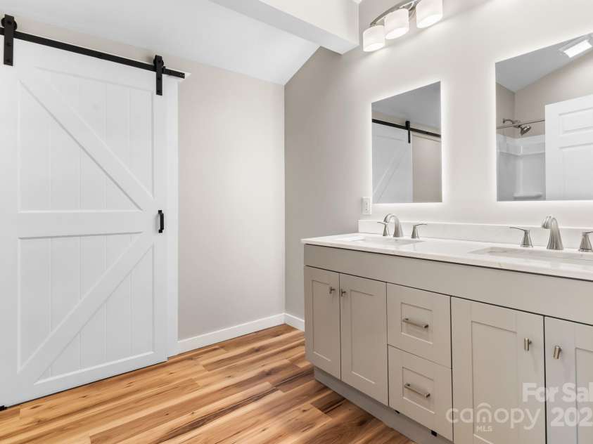 217 Royal Pines Drive, Arden, NC 28704.  MLS# CAR4257398, YatesRealty ID 13374. Sliding barn door leads to large walk-in closet