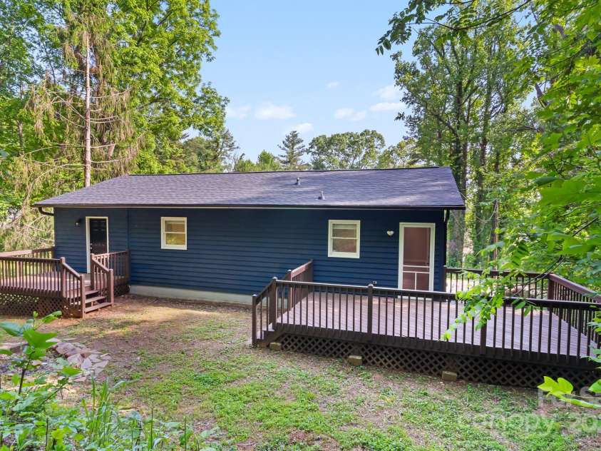 217 Royal Pines Drive, Arden, NC 28704.  MLS# CAR4257398, YatesRealty ID 13374. There are two rear decks, one off of the primary bedroom and one off of the kitchen.